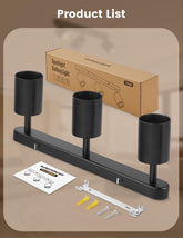 Black three-light fixture with packaging, installation manual, and tools on a beige background
